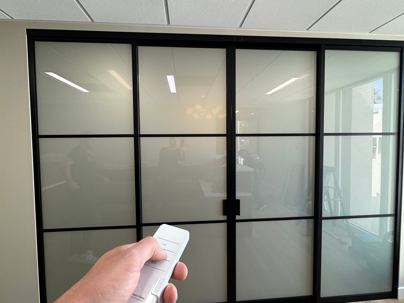 The same glass partition switched frosted at the press of the remote