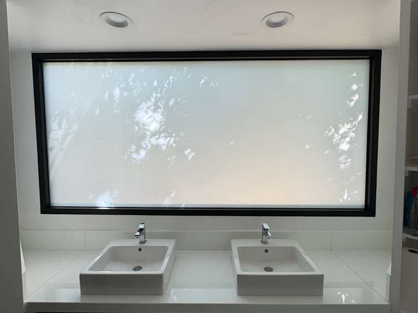 The same bathroom window switched frosted and private